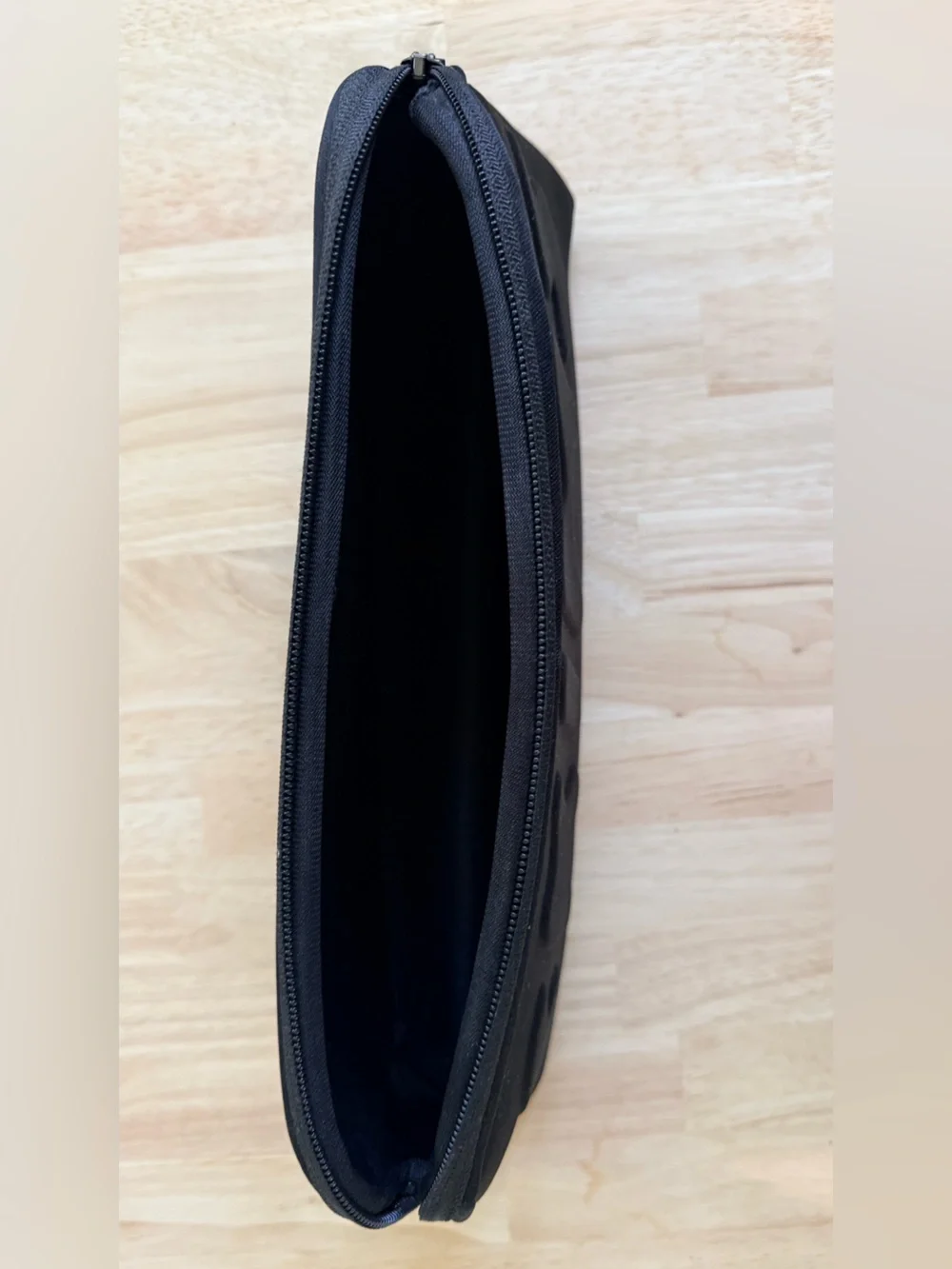 SKIMS Black Neoprene Toiletry Pouch with Raised Logo